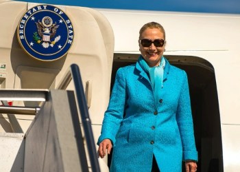 Hillary Clinton steps off a plane in Perth, Australia