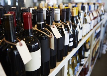 Bottles Of Wine On Display In Delicatessen