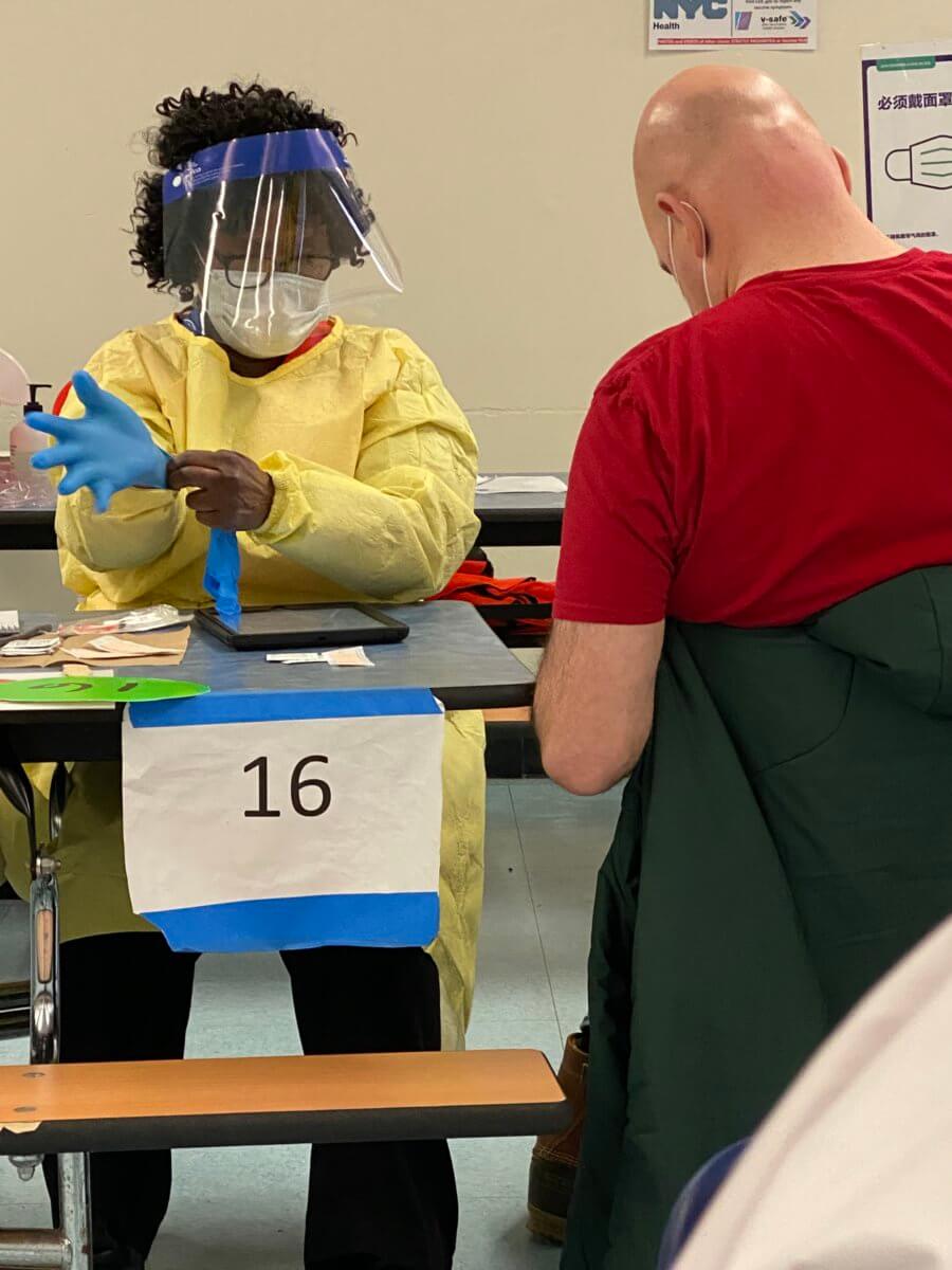 Everyone was given a number in the carefully organized cafeteria-turned-vaccination room.