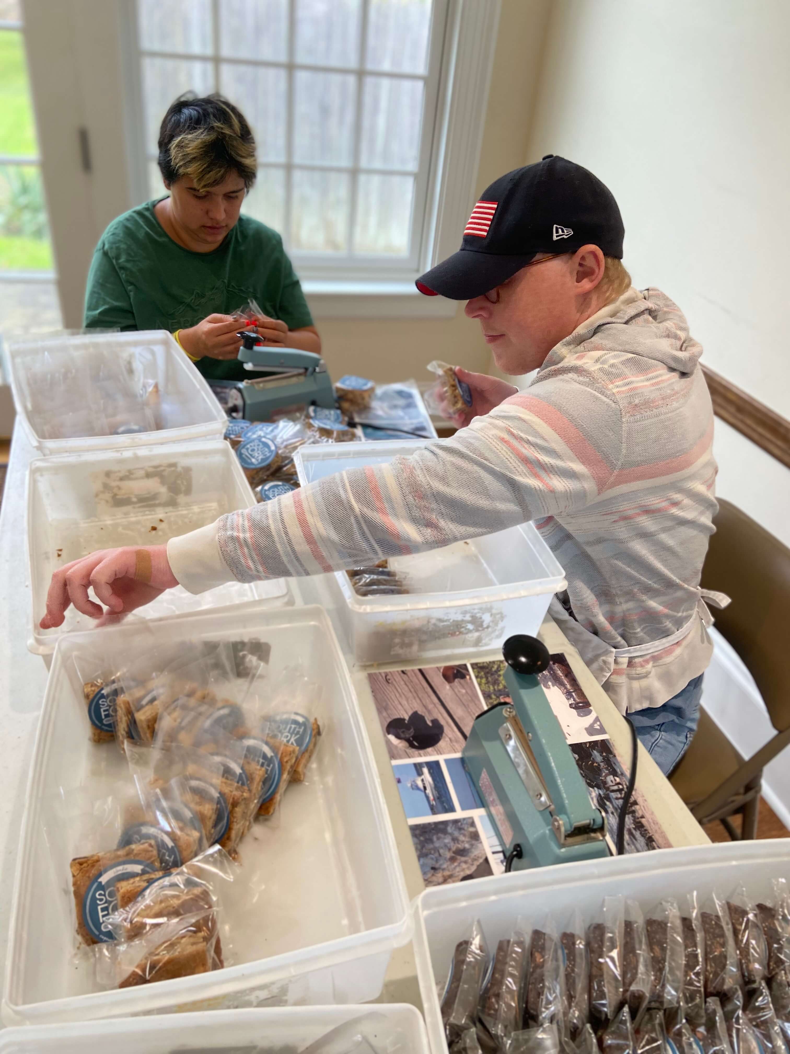 Employees on packaging and sealing duties at South Fork Bakery