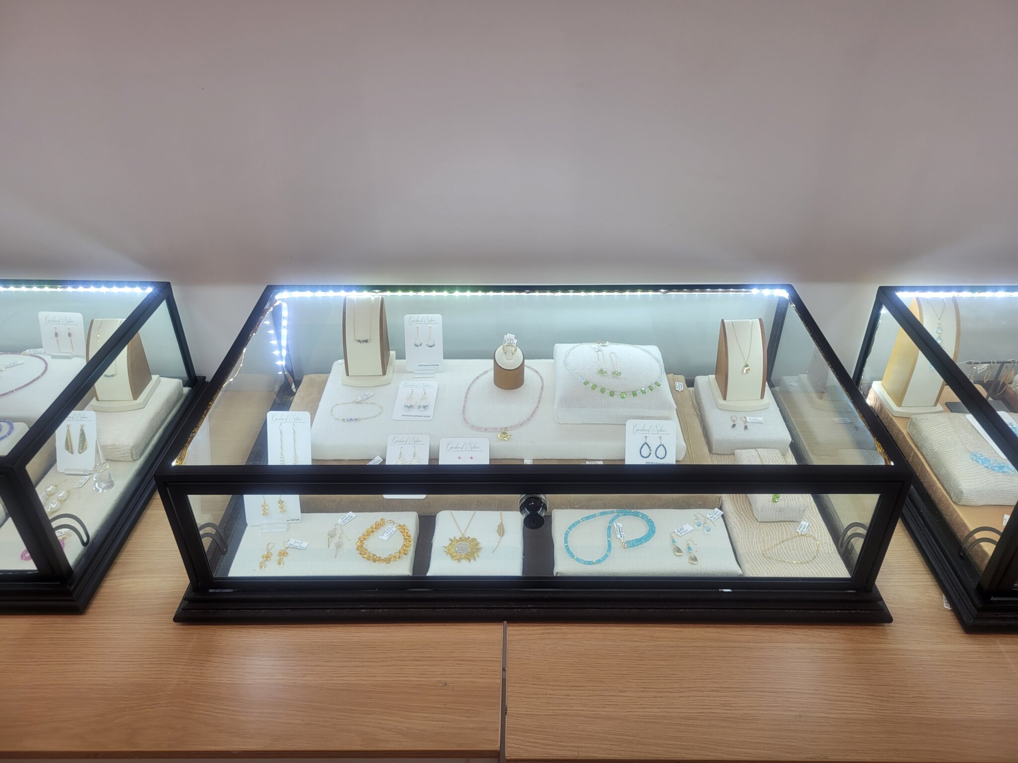 Eileen Baumeister McIntyre's Garden of Silver jewelry pieces at Art Studio Hamptons Gallery