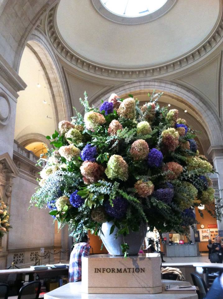 Flowers at the Met's Great Hall Information Desk.
